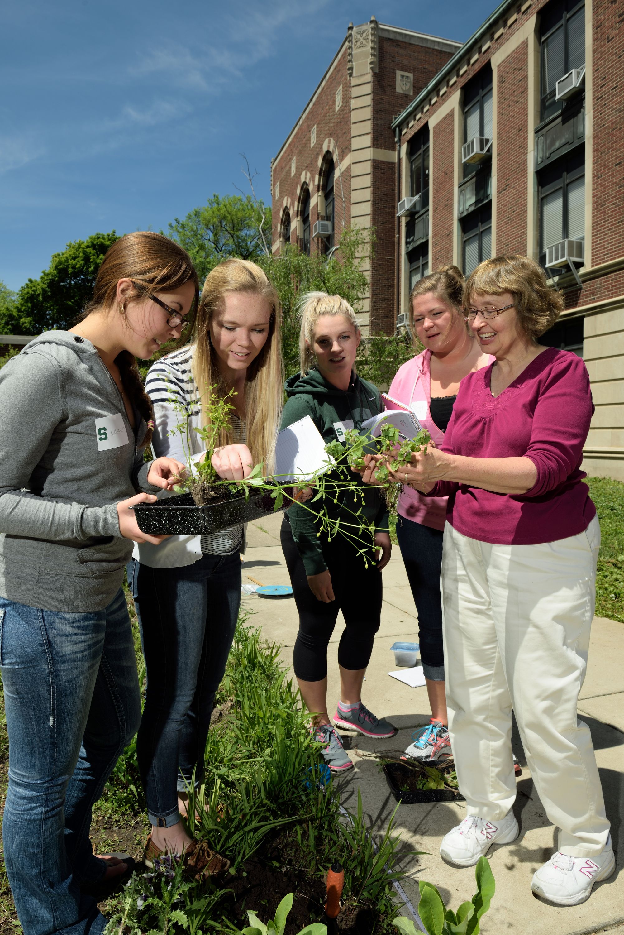 Image of Dr. Jane Rice and ISE students in the Kedzie Garden.